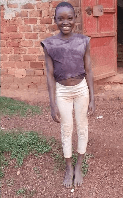 An image of CATHERINE KATAIKE standing and smiling